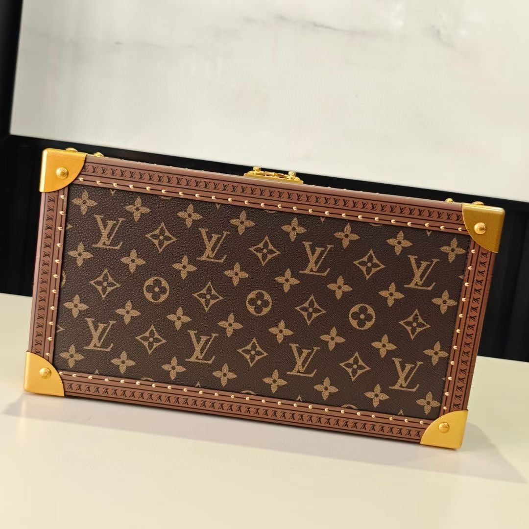 Louis Vuitton monogram trunk bag, front view, with gold corner caps and clasp