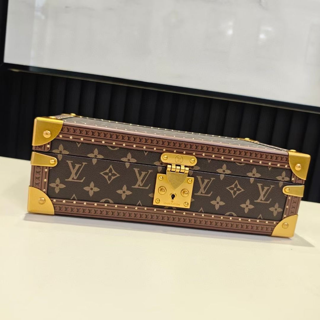 Louis Vuitton monogram trunk bag, closed, with gold hardware and brass latch