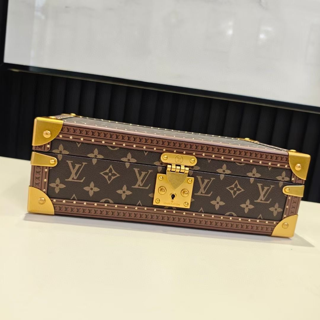 Louis Vuitton monogram trunk bag, closed, with gold hardware and brass latch