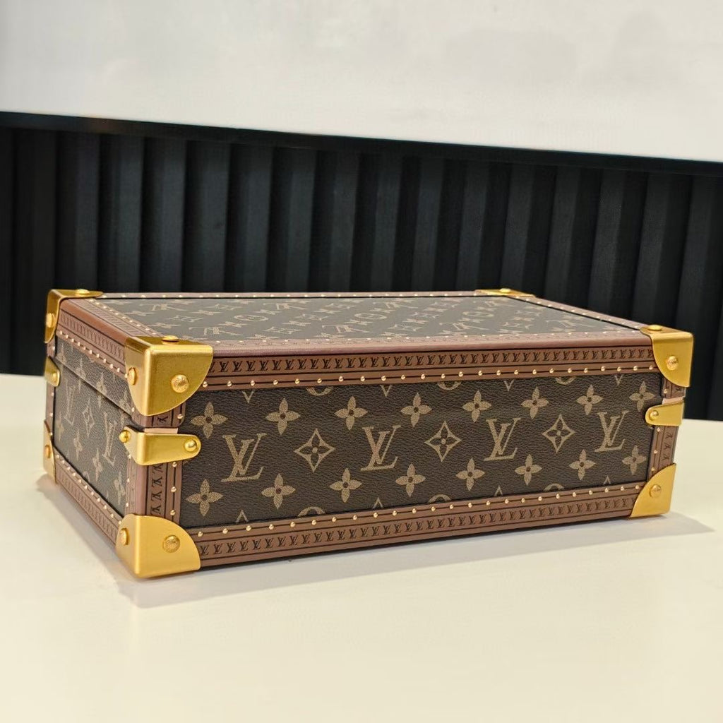 Louis Vuitton monogram trunk bag with gold trim and corner studs, closed
