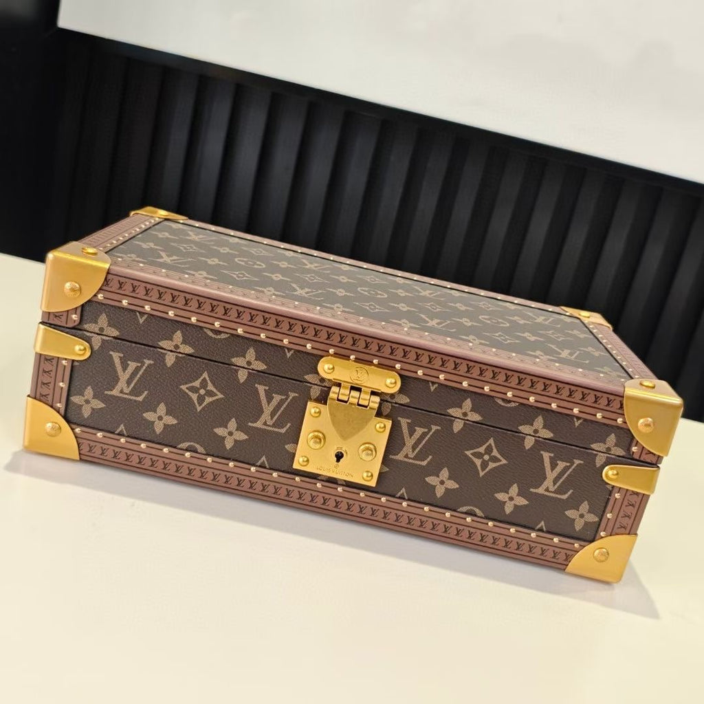 Louis Vuitton monogram trunk bag with gold hardware and blue interior, closed