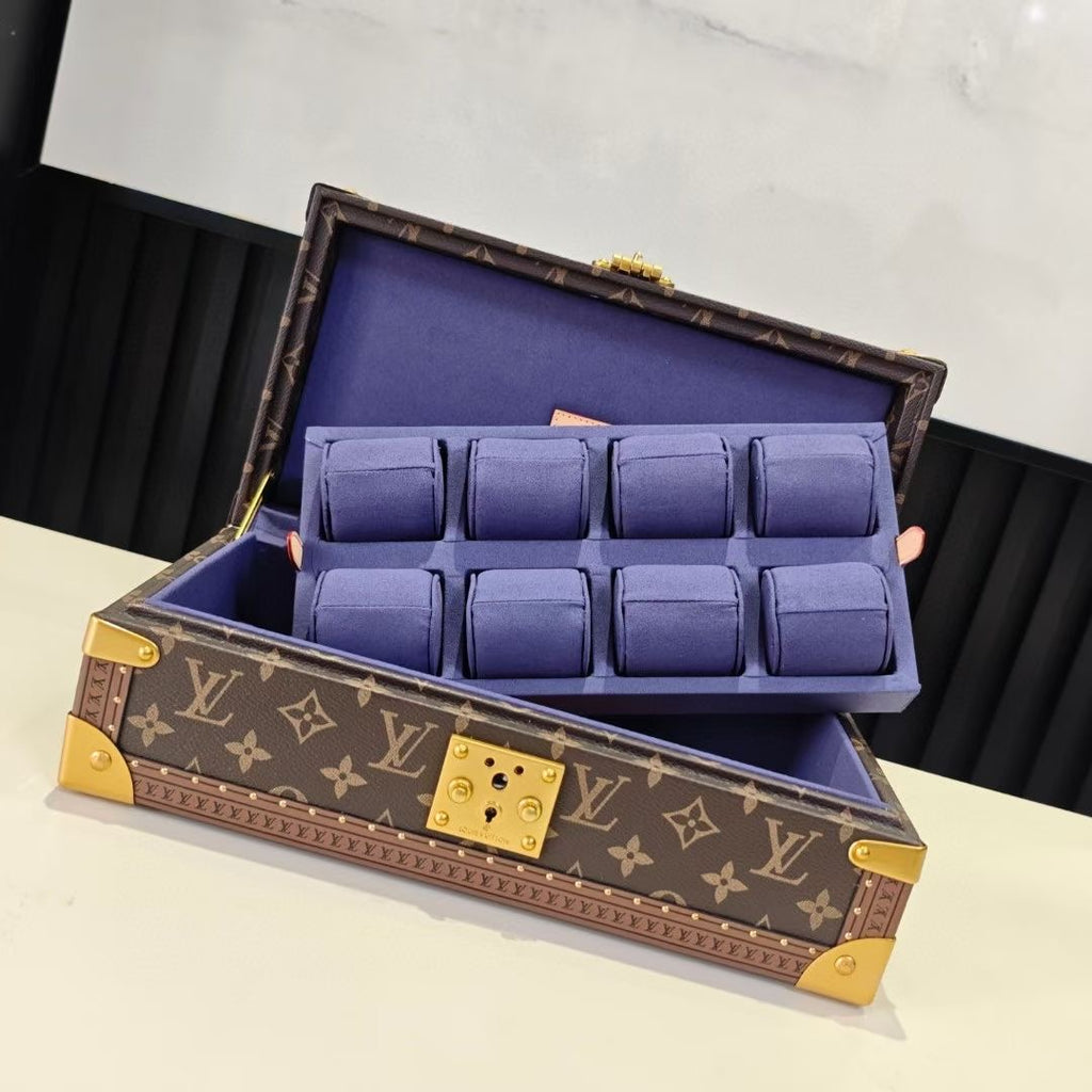 Louis Vuitton monogram trunk bag with blue compartments, open lid on display