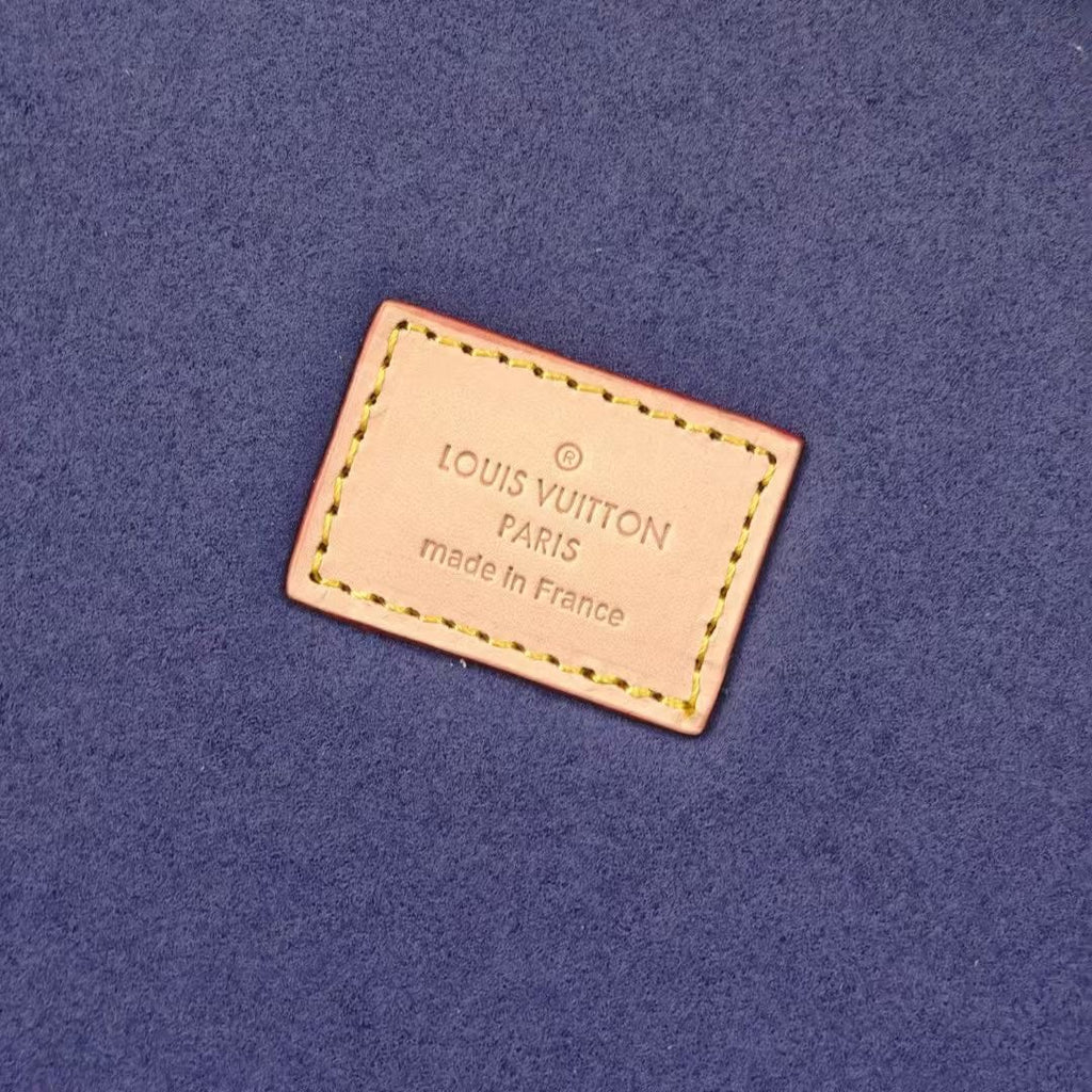 Louis Vuitton Paris label on blue fabric interior lining