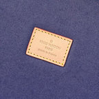 Louis Vuitton Paris label on blue fabric interior lining