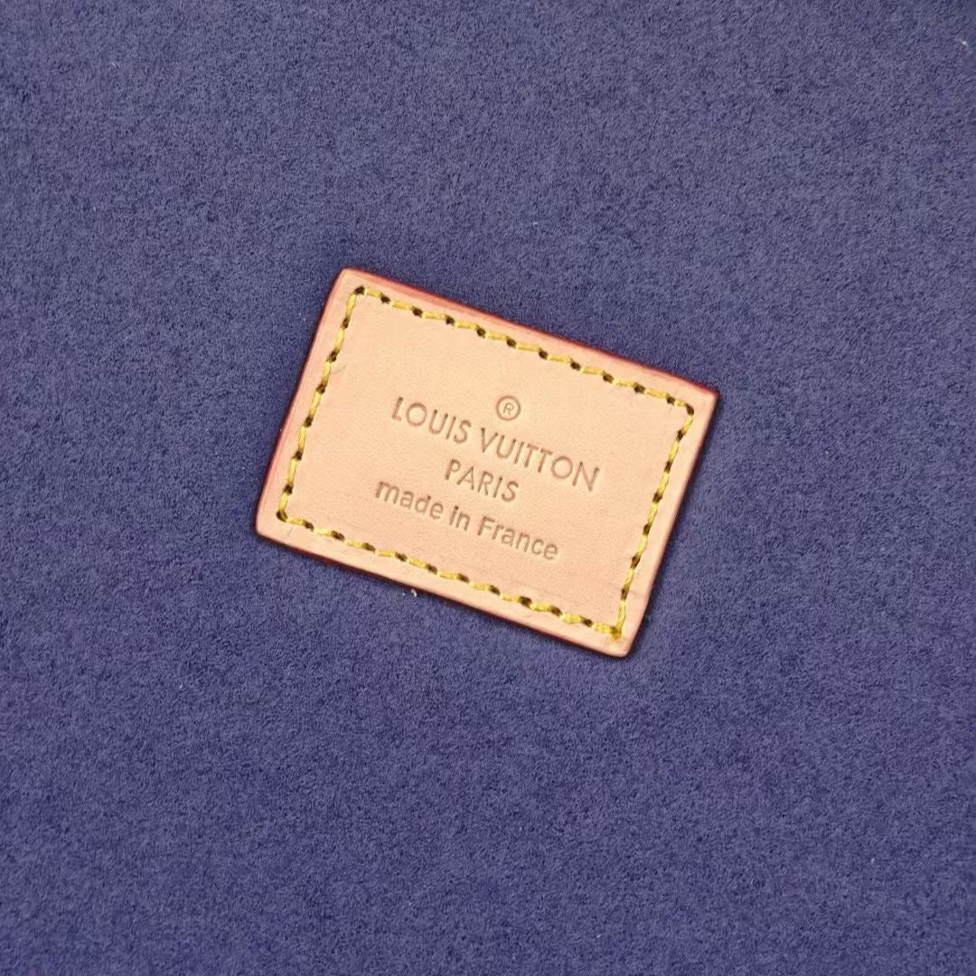 Louis Vuitton Paris label on blue fabric interior lining