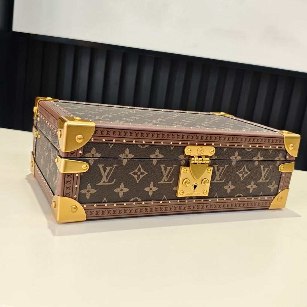 Louis Vuitton monogram trunk bag with gold corner fittings and brass lock, closed