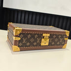 Louis Vuitton monogram trunk bag with gold corner fittings and brass lock, closed