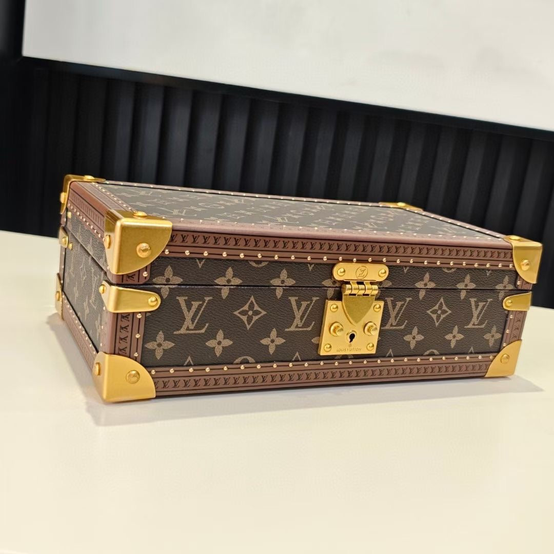 Louis Vuitton monogram trunk bag with gold corner fittings and brass lock, closed