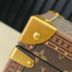 Louis Vuitton monogram trunk clasp and gold button detail