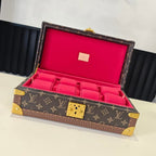 Louis Vuitton monogram trunk with open lid, gold corners, pink interior lining