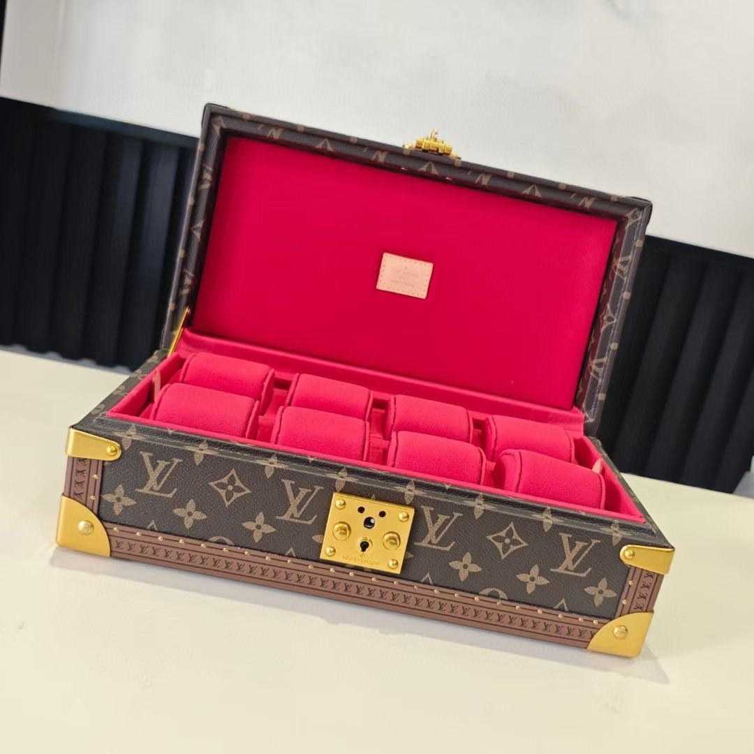 Louis Vuitton monogram trunk with open lid, gold corners, pink interior lining