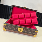 Louis Vuitton monogram trunk open with pink organizer and cushioned slots