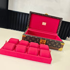 Louis Vuitton monogram trunk with open lid and pink interior display