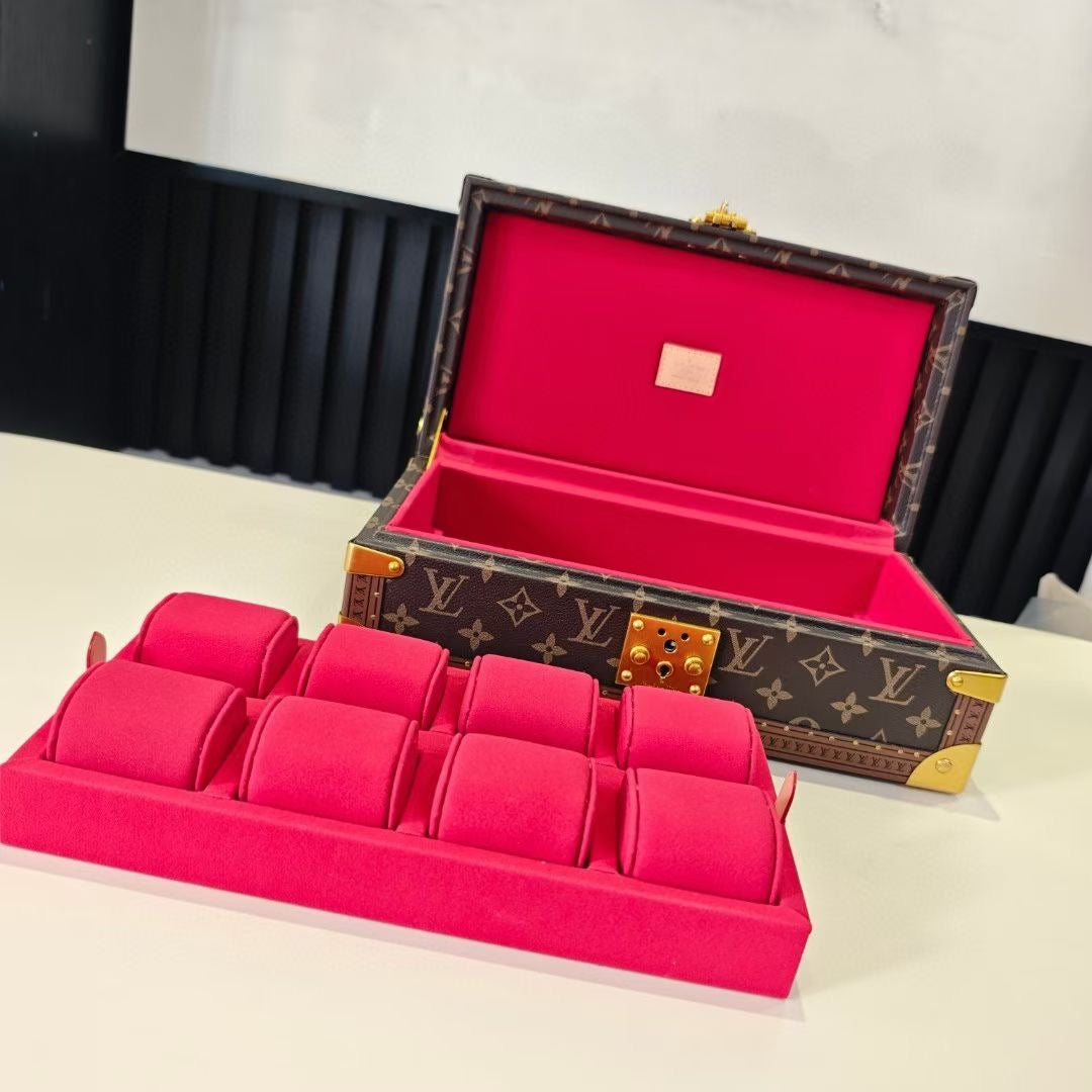 Louis Vuitton monogram trunk with open lid and pink interior display