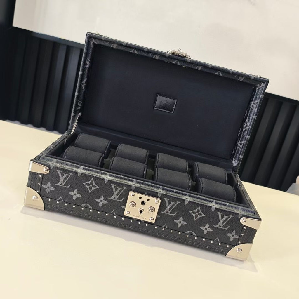 Louis Vuitton monogram storage trunk with open lid, black interior compartments
