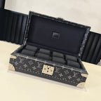 Louis Vuitton monogram storage trunk with open lid, black interior compartments