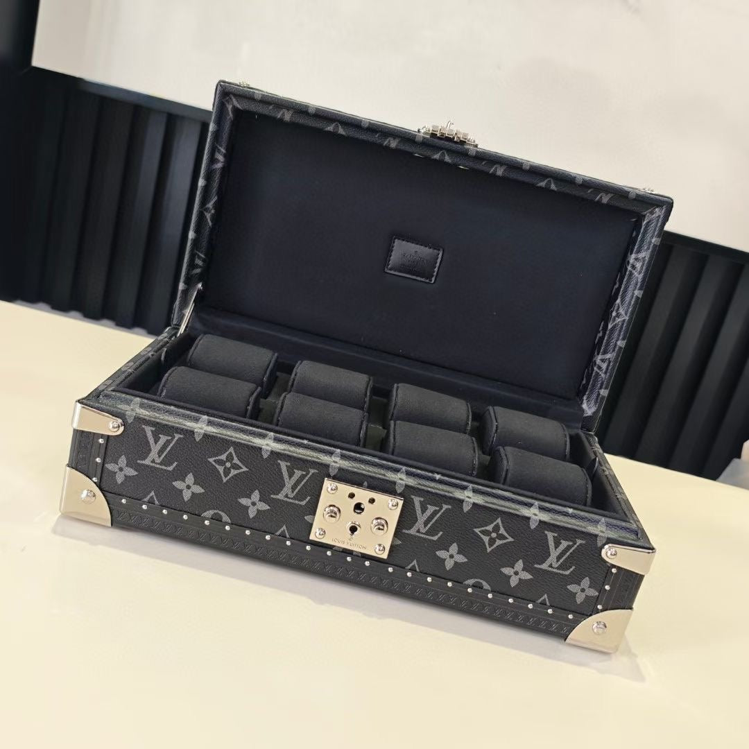 Louis Vuitton monogram storage trunk with open lid, black interior compartments