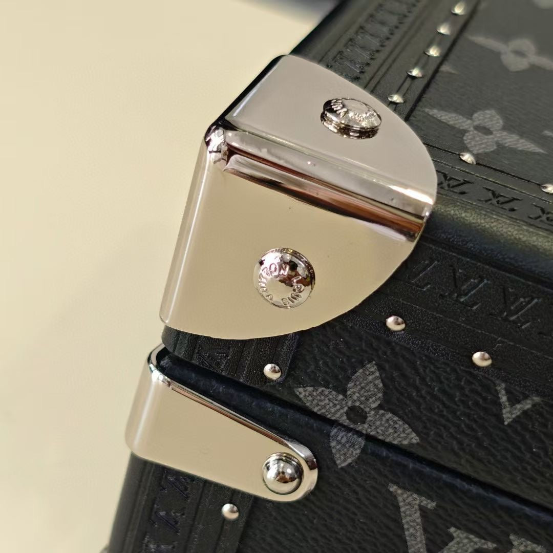 Louis Vuitton monogram trunk corner clasp with chrome hardware and rivets