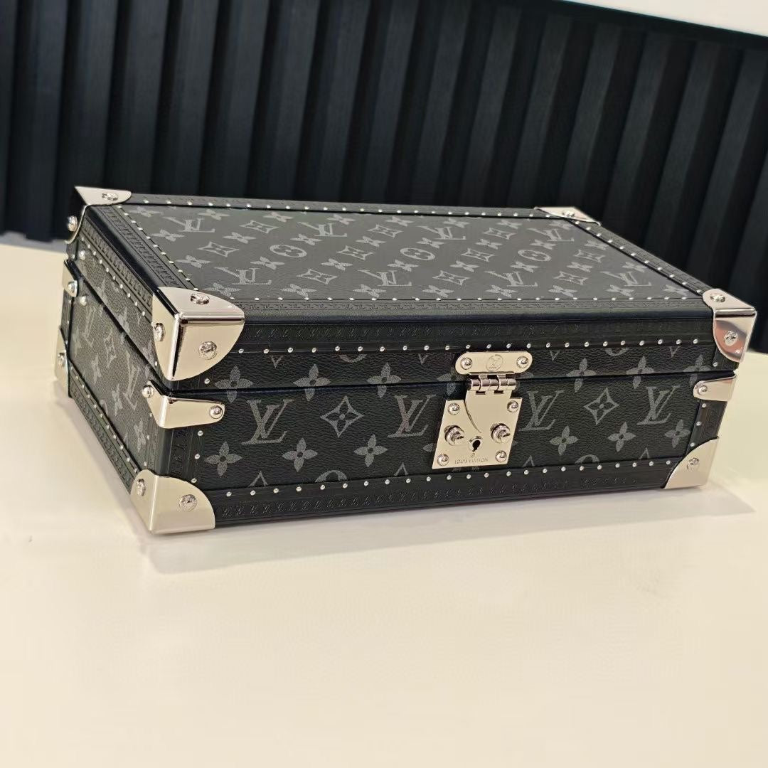 Louis Vuitton monogram storage trunk, top view with metal corner hardware and latch