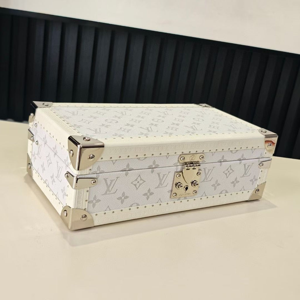 Louis Vuitton monogram jewelry box with gold-tone clasp and studded trim, light color
