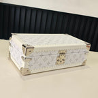 Louis Vuitton monogram jewelry box with gold-tone clasp and studded trim, light color
