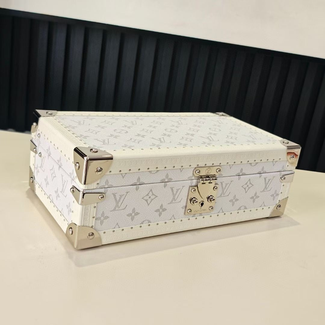 Louis Vuitton monogram jewelry box with gold-tone clasp and studded trim, light color