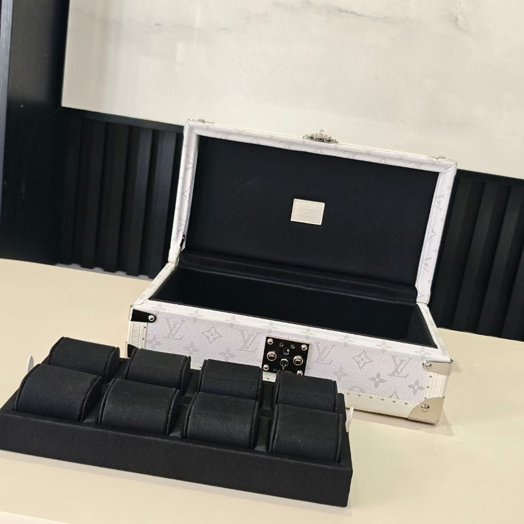 Louis Vuitton monogram jewelry box open with black interior and partition tray