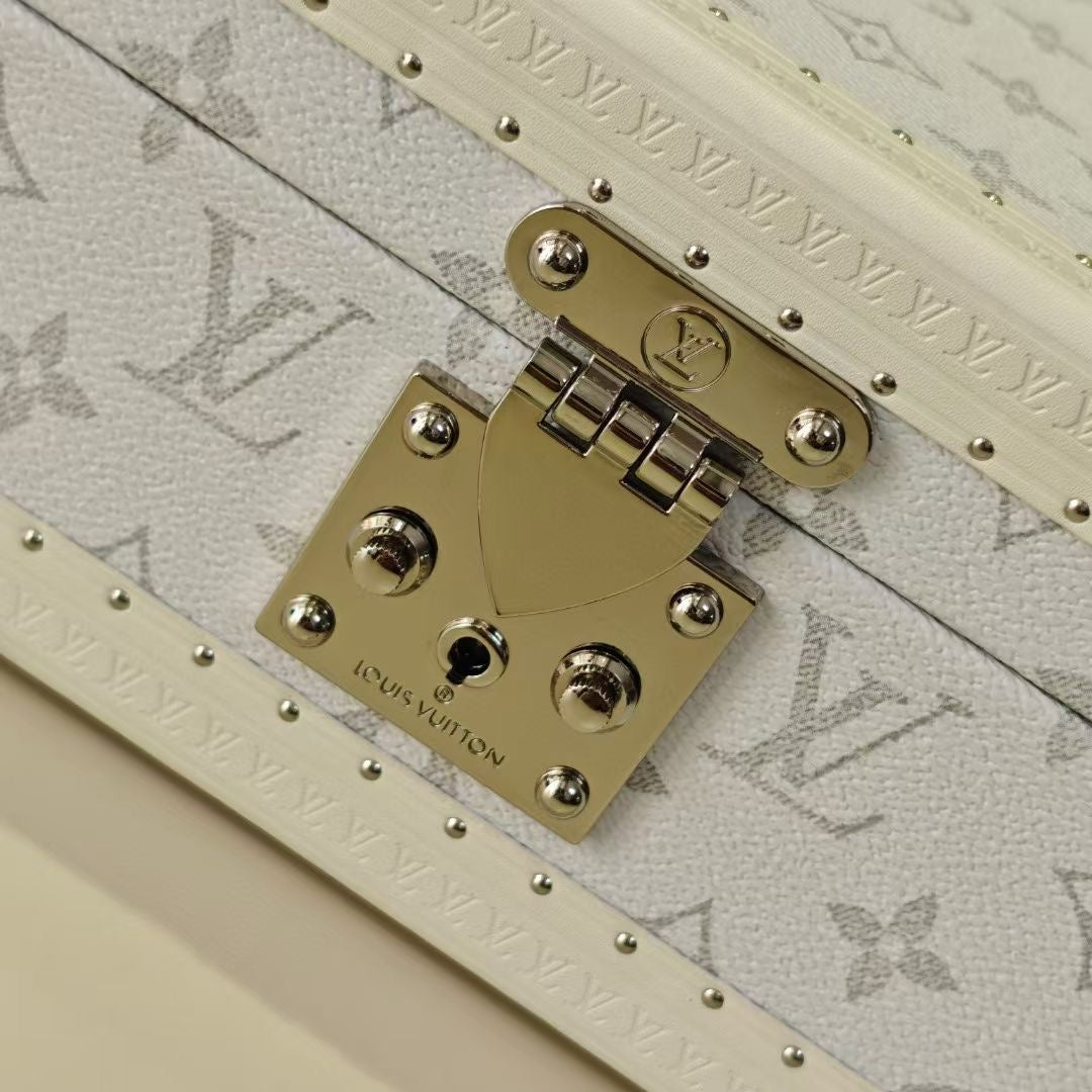 Louis Vuitton monogram jewelry box lock plate with engraved medallion and rivets