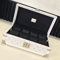 Louis Vuitton monogram jewelry box with open lid and black cushion compartments
