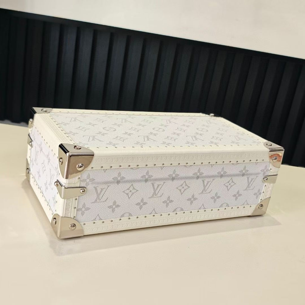 Louis Vuitton monogram jewelry box with gold-tone corner hardware and hinged lid