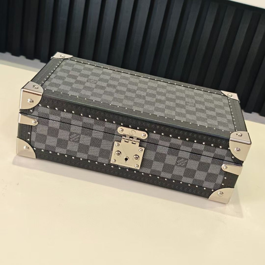 Checkered storage case with studded trim and metal clasp, closed