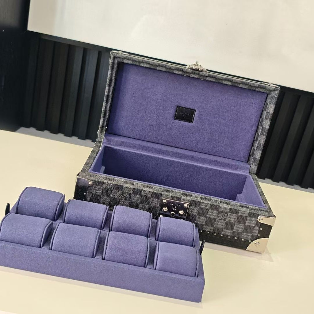 Checkered storage case open with purple lined compartment and gold hardware