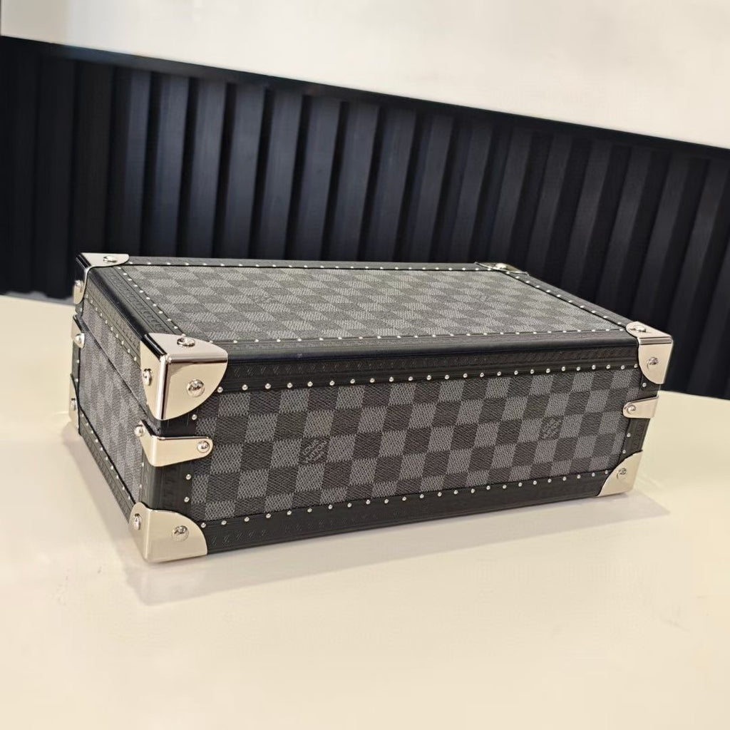 Checkered storage case with metal corner details and studded edge, front view