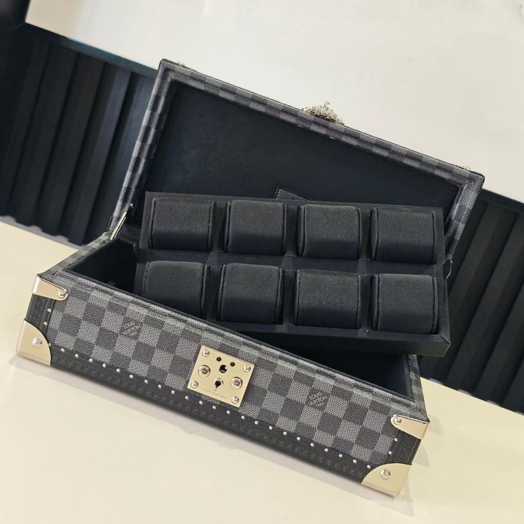 Louis Vuitton check-pattern jewelry case open with padded black dividers