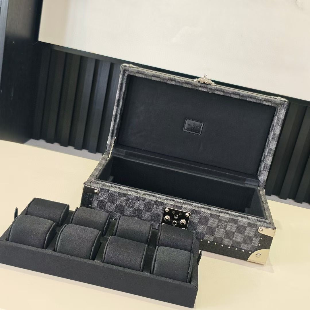 Louis Vuitton check-pattern case open with padded tray and black interior lining