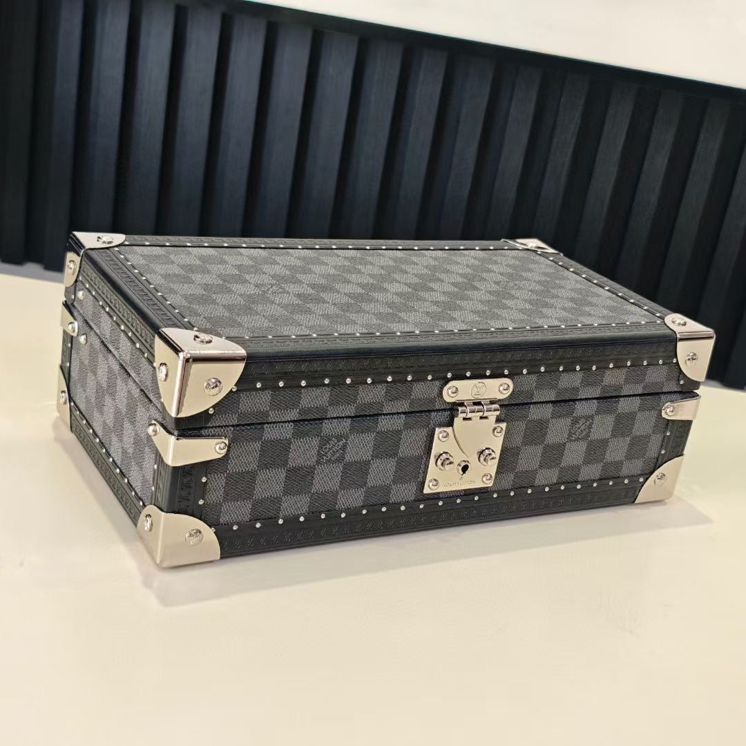 Louis Vuitton check-pattern trunk case with metal corner hardware and central clasp