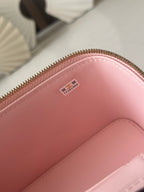 Chanel mini bag interior close-up of pink lining and small white label