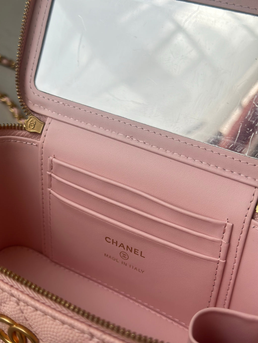 Chanel mini bag interior card pocket with CHANEL logo on pink lining