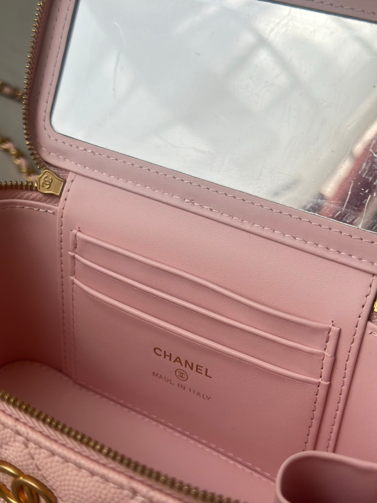 Chanel mini bag interior card pocket with CHANEL logo on pink lining