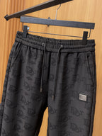 Black Dior monogram drawstring pants with logo patch and slant side pockets