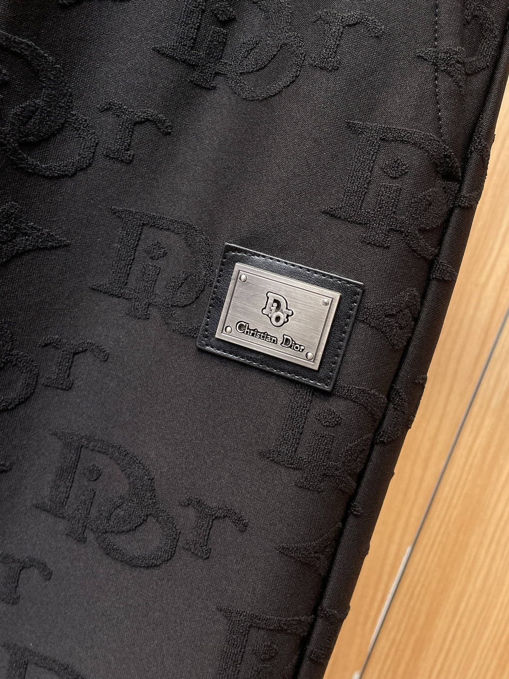 Dior monogram pants with rectangular logo patch near the thigh