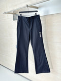 Navy straight-leg pants with belt loops and front zip fly on hanger