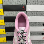 Pink low-top sneaker tongue and collar lining with lace-up front close-up.