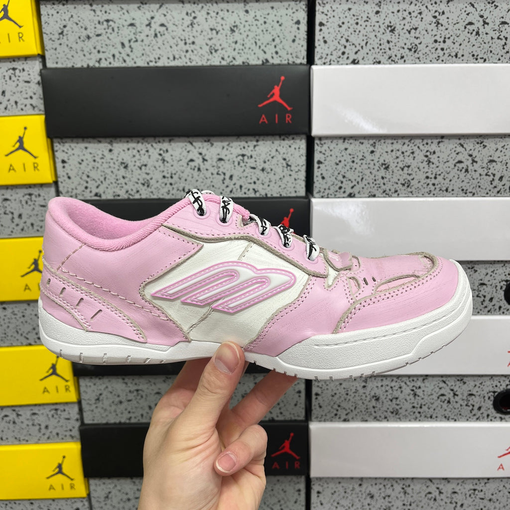 Pink and white low-top Balenciaga unisex sneakers, front side view, lace-up.