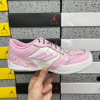 Pink and white low-top Balenciaga unisex sneakers, front side view, lace-up.