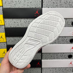White sneaker outsole tread with '38' marking, bottom view.
