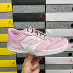 Pink and white low-top Balenciaga unisex sneakers with lace-up front.