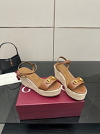 Women's tan espadrille wedge sandals with slingback strap and gold buckle