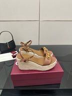 Tan leather platform wedge sandals with double gold buckle straps