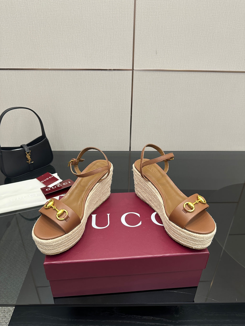 Tan leather espadrille platform wedge sandals with gold buckle on upper